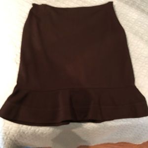 Black suit skirt with slight flair.